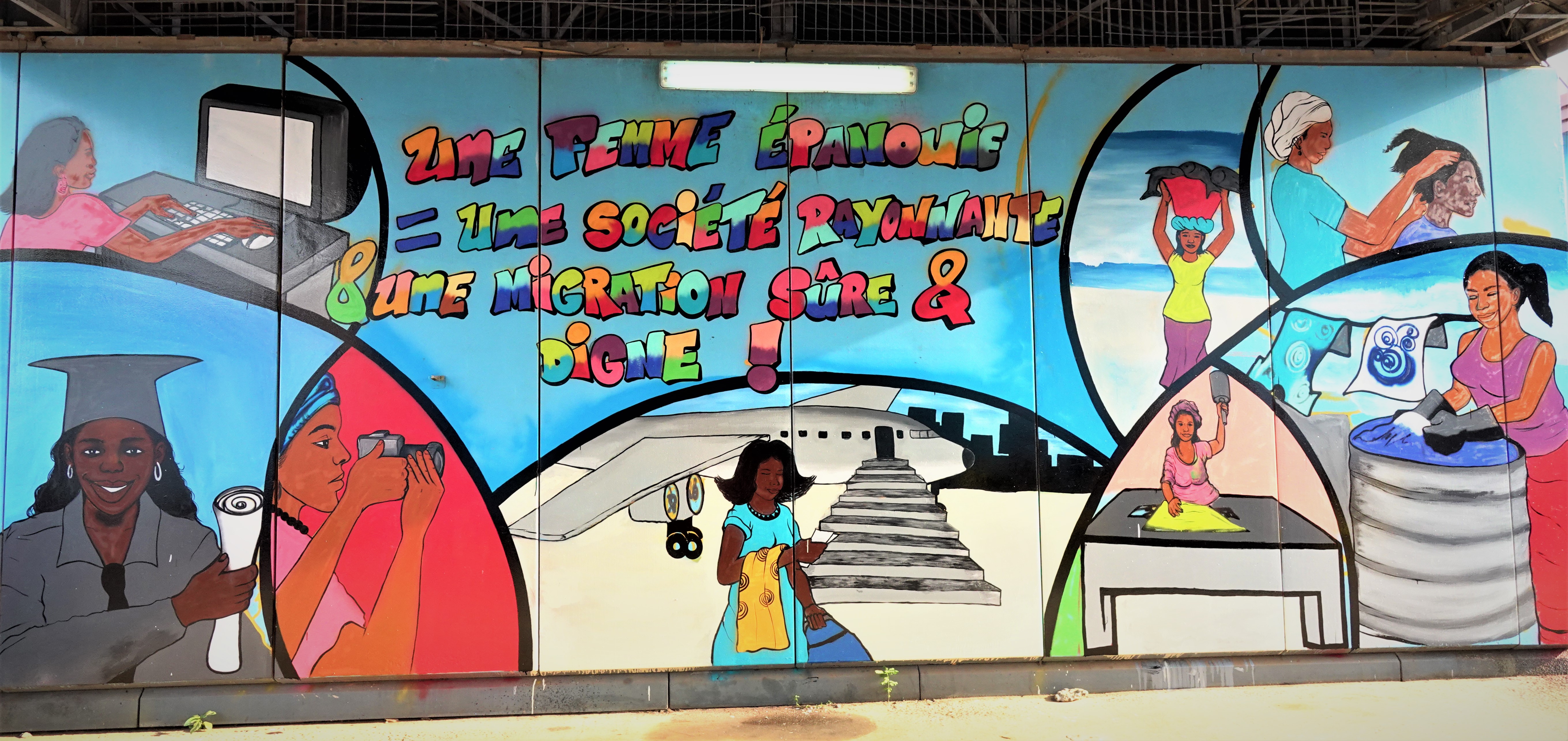 Une peinture murale dans les rues de Conakry. Crédit: OIM/Guinée Conakry